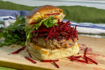 Image of a lamb burger in a brioche bun with salad