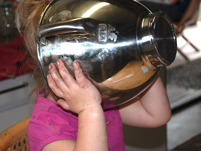 Ava aged 3 cleaning the mixing bowl